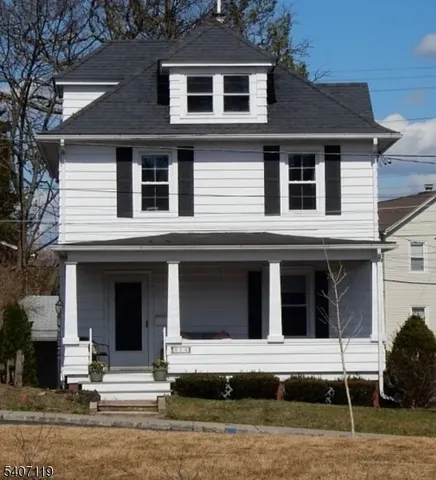 a house that has a window in front of a house