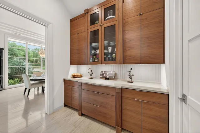 a view of a kitchen with a sink and cabinets