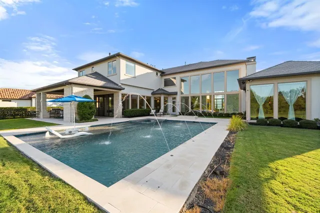 a view of a yard with swimming pool