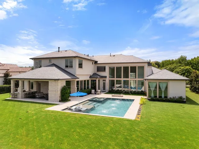 a view of swimming pool with a yard
