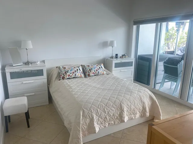 a bedroom with a bed and a table