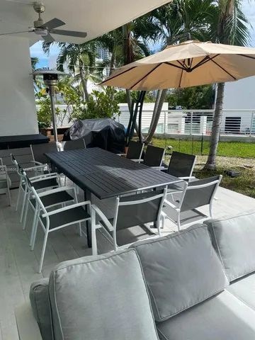 a patio with table and chairs