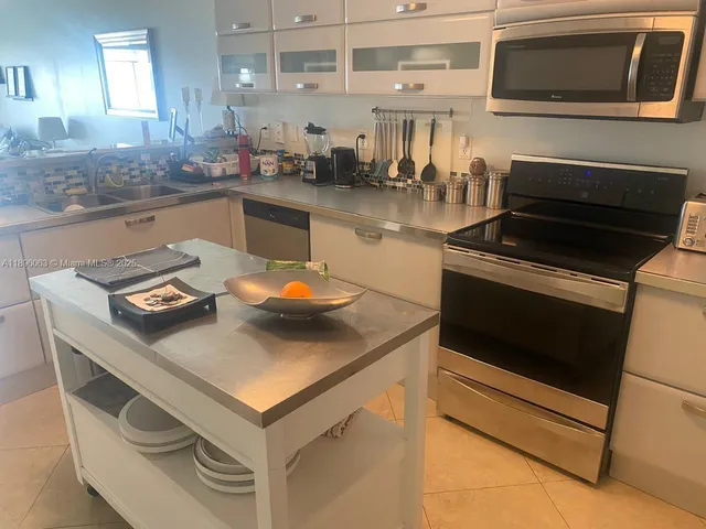 a kitchen with a stove and a microwave