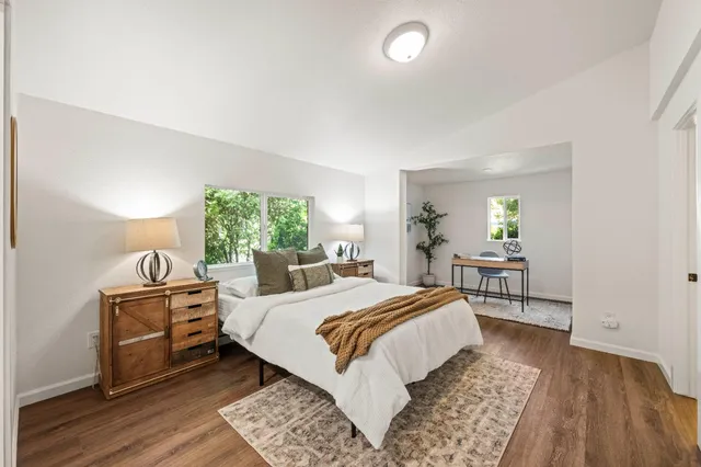 a bedroom with a bed and a table