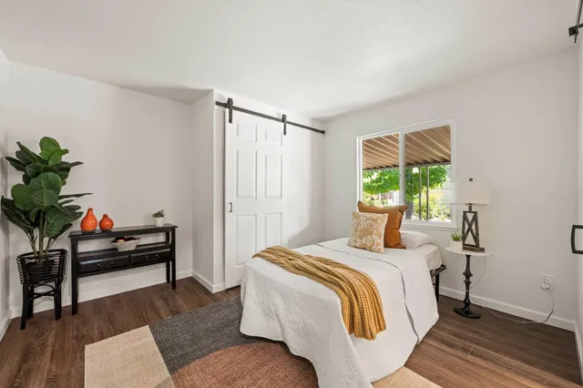 a bedroom with a bed furniture and a window