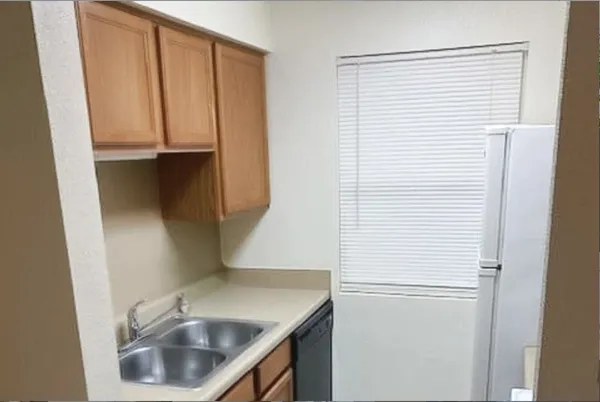 a kitchen with a sink and cabinets