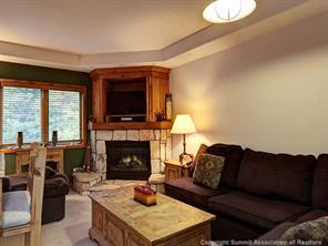 655 4 O Clock Road, Unit 109 Breckenridge, CO 80424 - Photo 2 of 17 a living room with furniture and a fireplace