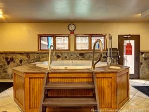 655 4 O Clock Road, Unit 109 Breckenridge, CO 80424 - Photo 17 of 17 a view of a sink and dishwasher with wooden floor
