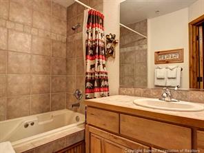 655 4 O Clock Road, Unit 109 Breckenridge, CO 80424 - Photo 10 of 17 a bathroom with a bathtub and a sink