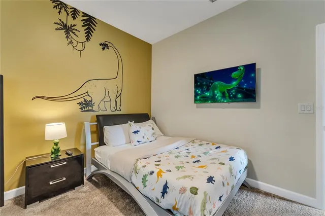 a front view of a house with a garden and plants