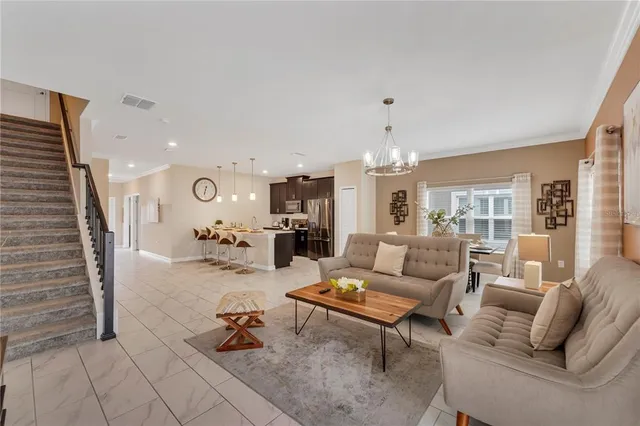 a view of living room with furniture and wooden floor
