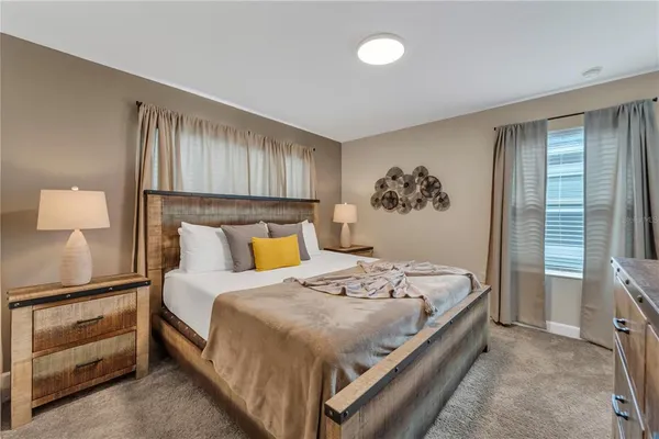 a front view of a house with a yard and a garage