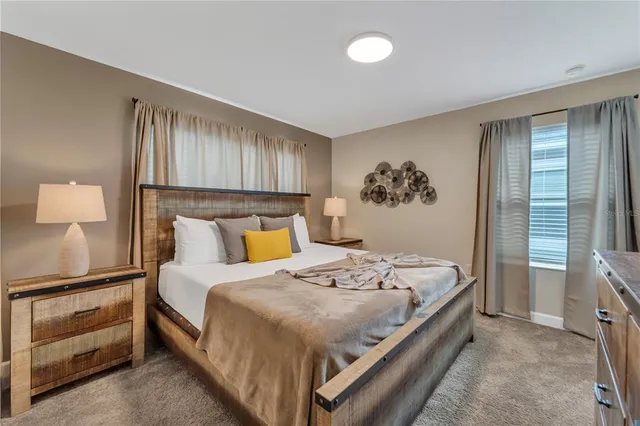 a front view of a house with a yard and a garage