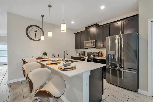 a bedroom with a bed a table and painting on the wall