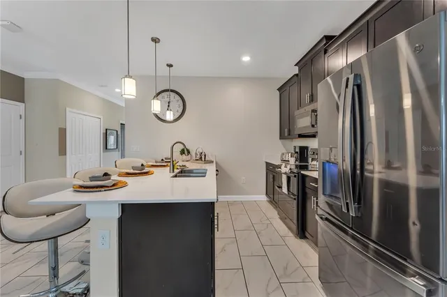a view of a dining room with furniture window and outside view