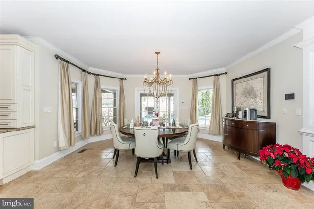 a kitchen with kitchen island a sink a center island and cabinets