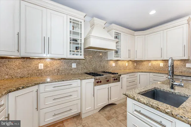 a bathroom with a sink a mirror and a shower