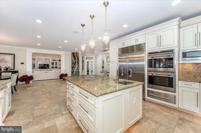 a spacious bathroom with a double vanity sink a mirror and a bathtub