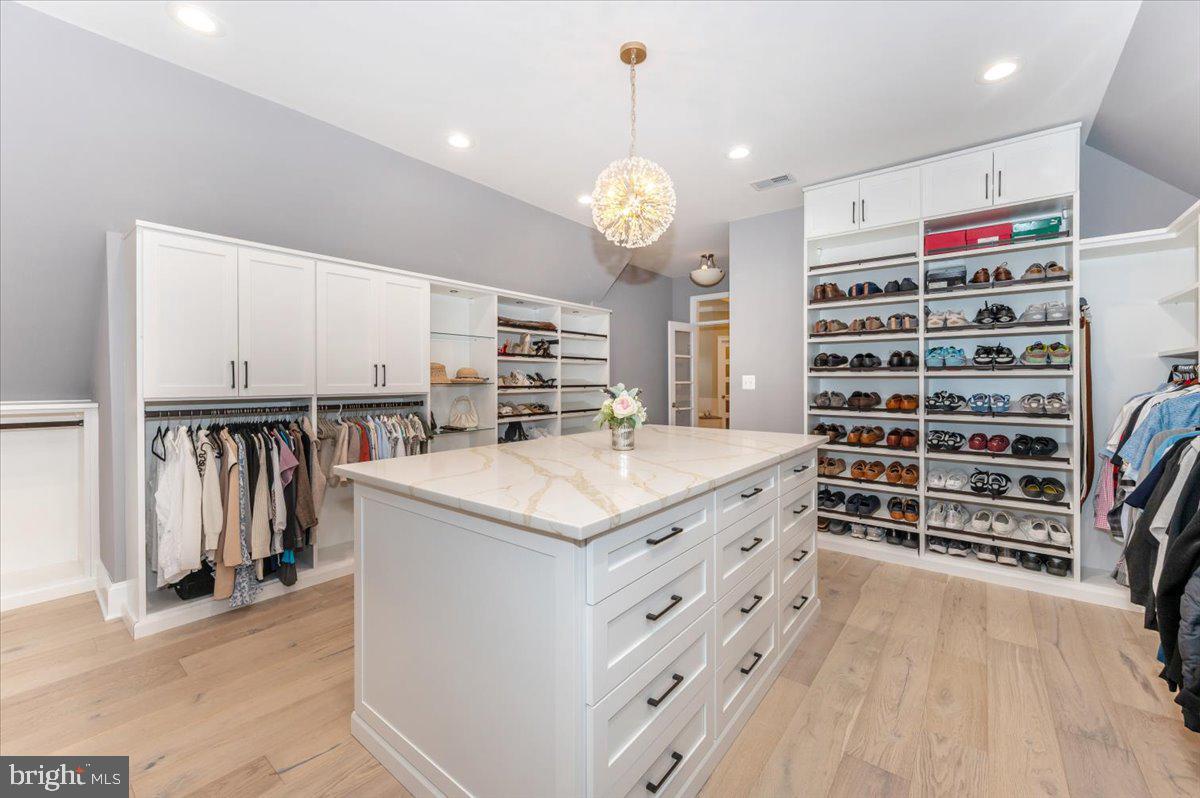 11793 Frederick Road Ellicott City, MD 21042 - Photo 19 of 46 a kitchen with granite countertop a white cabinets and window