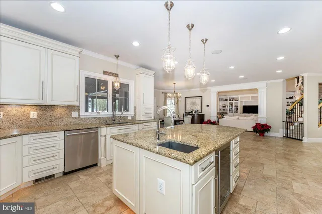 a bathroom with a granite countertop bathtub a sink and a shower