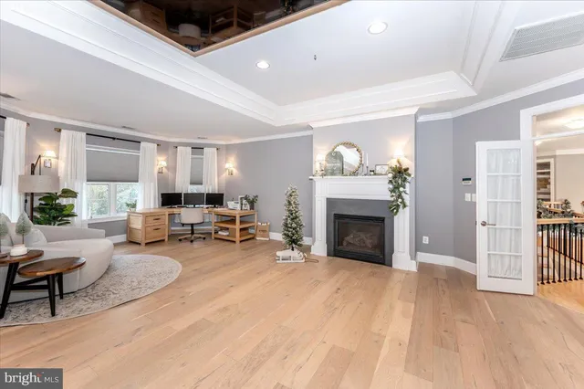 a kitchen with granite countertop a white cabinets and window