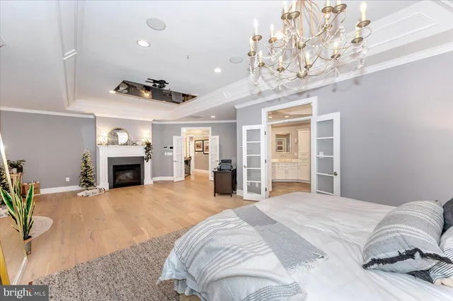 a bedroom with furniture and a flat screen tv