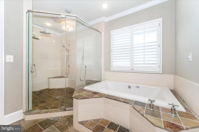 a bedroom with a bed a mirror and a window