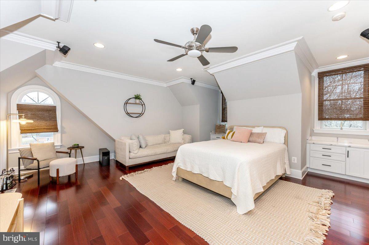 11793 Frederick Road Ellicott City, MD 21042 - Photo 31 of 46 a bedroom with a large bed and a chandelier