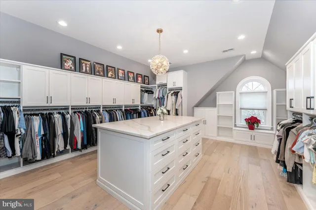 a dining room with stainless steel appliances kitchen island granite countertop a table and chairs
