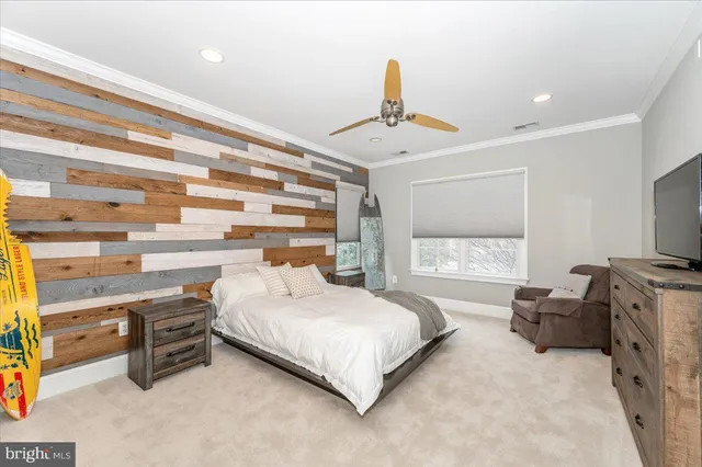 a room with gym equipment and view of living room