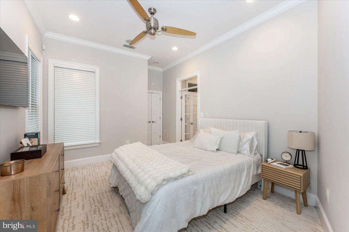 11793 Frederick Road Ellicott City, MD 21042 - Photo 35 of 46 a bedroom with a bed and a night stand