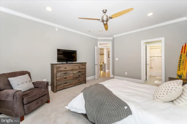 a kitchen with stainless steel appliances a stove a sink a dining table and chairs