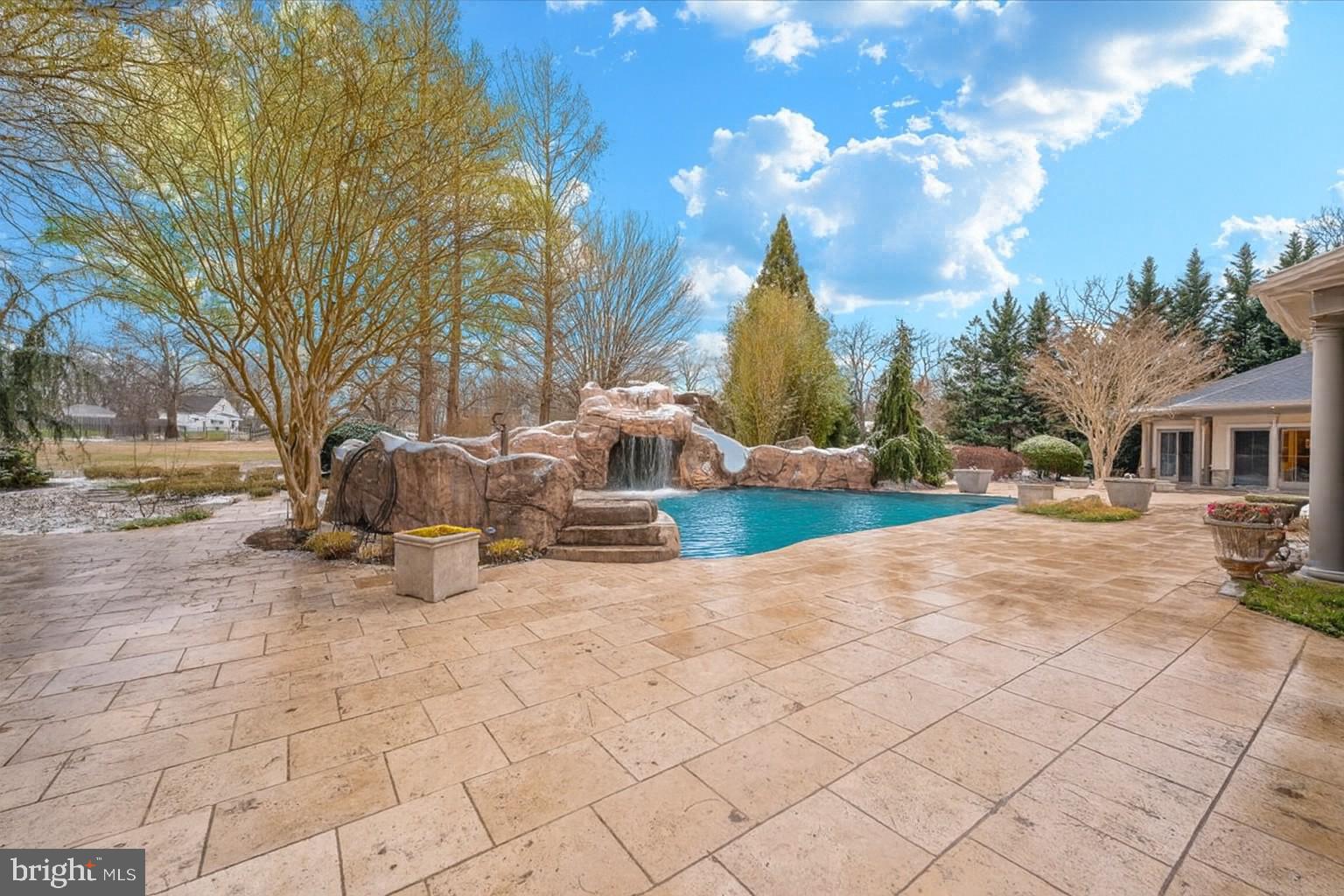 11793 Frederick Road Ellicott City, MD 21042 - Photo 38 of 46 a view of a white house with a yard and entertaining space