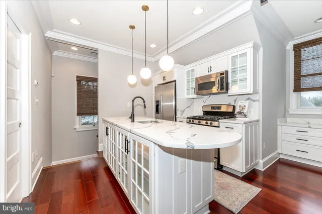 a front view of a house with a yard and a garage