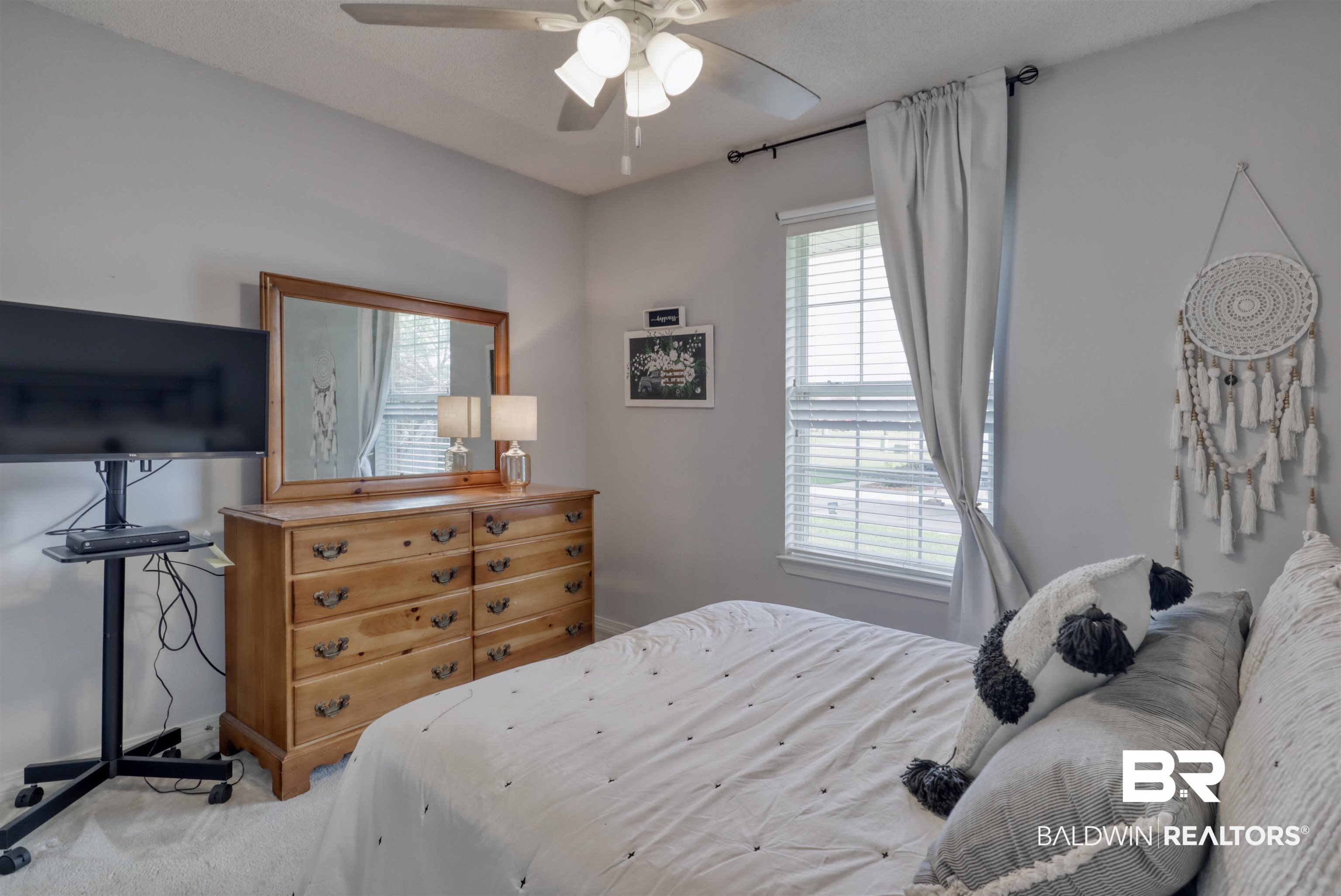 12893 Hunters Chase Foley, AL 36535 - Photo 29 of 42 Bedroom with ceiling fan and carpet floors