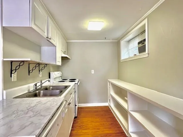 a kitchen with a sink stove and refrigerator