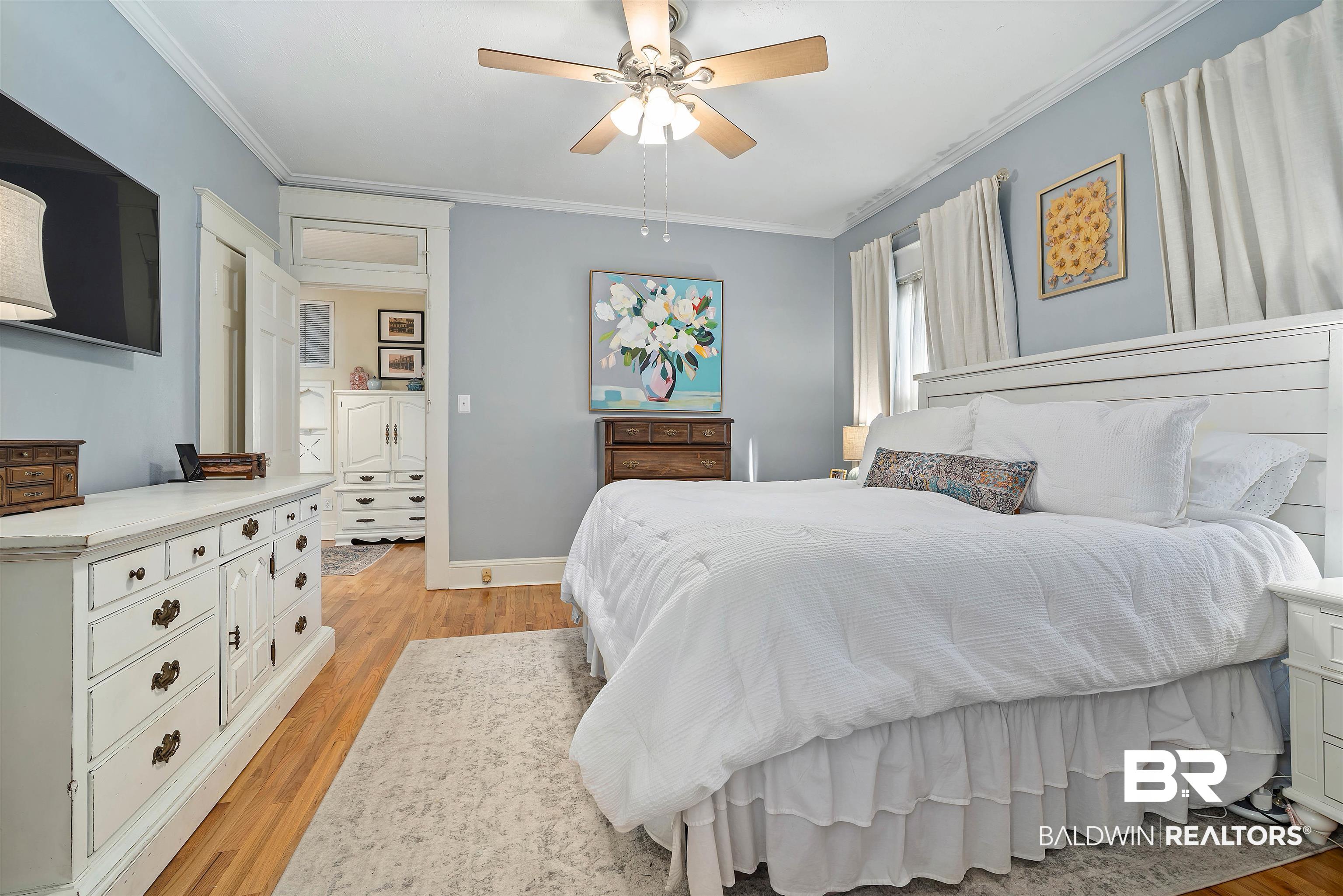 168 Mohawk Street Mobile, AL 36606 - Photo 17 of 31 Bedroom featuring light wood-style floors, crown molding, and ceiling fan