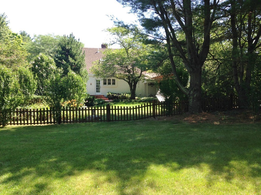 111 Bay Road Easton, MA 02356 - Photo 29 of 30 a view of a deck with a big yard and large trees