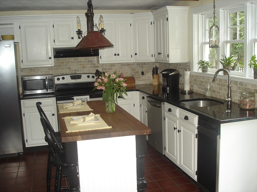 111 Bay Road Easton, MA 02356 - Photo 10 of 30 a kitchen with a stove a sink and a refrigerator