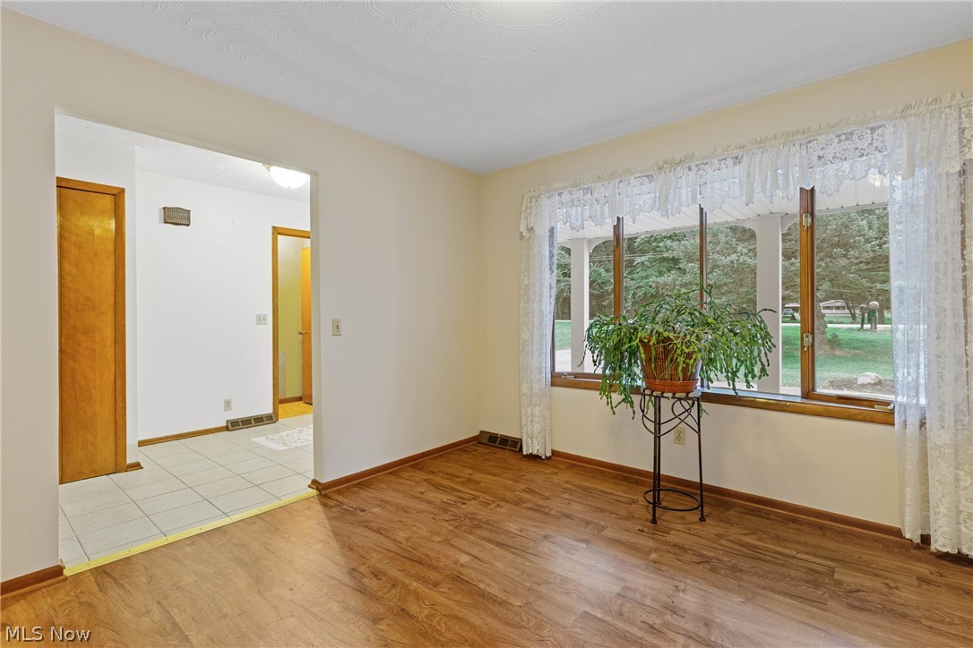 16295 Sperry Road Vermilion, OH 44089 - Photo 8 of 48 Spare room featuring light wood-type flooring
