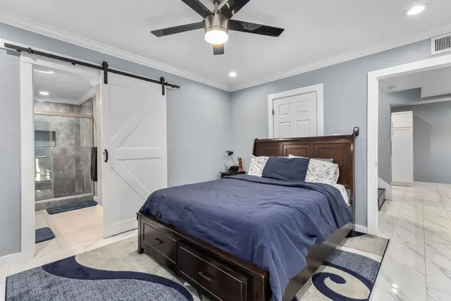 a bedroom with a bed and window