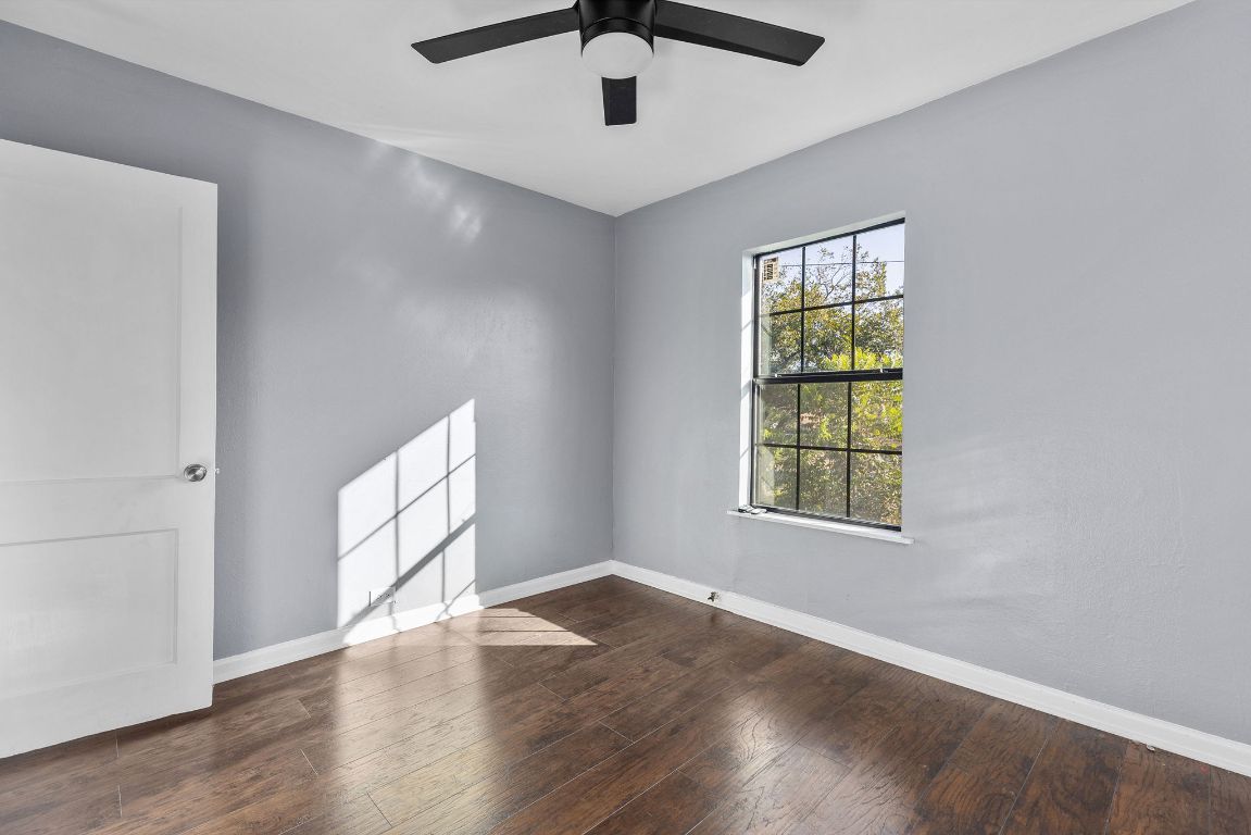 1110 South 9th Street Temple, TX 76504 - Photo 22 of 27 wooden floor in an empty room with a window