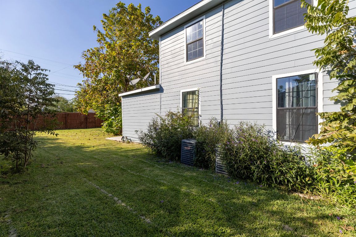 1110 South 9th Street Temple, TX 76504 - Photo 26 of 27 a view of a backyard with plants and large tree