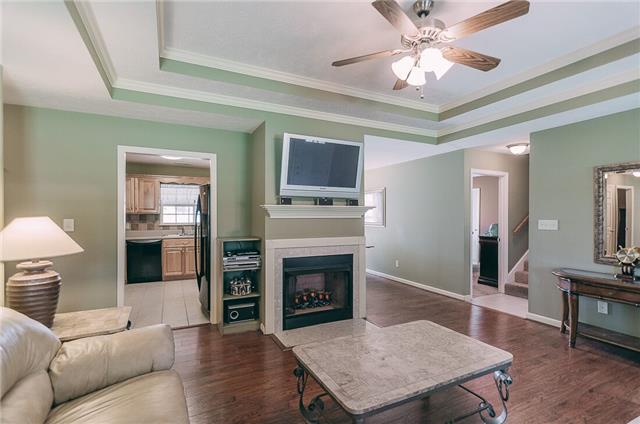 789 Rock Springs Road Castalian Springs, TN 37031 - Photo 3 of 20 Gorgeous, welcoming living room that feels open and has a lovely fireplace and trey ceilings and crown molding!