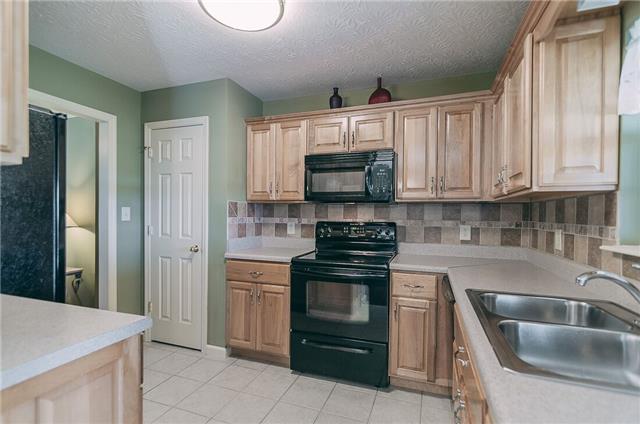 789 Rock Springs Road Castalian Springs, TN 37031 - Photo 5 of 20 Kitchen off of Dining Room and has a beautiful tiled backsplash and tiled flooring!