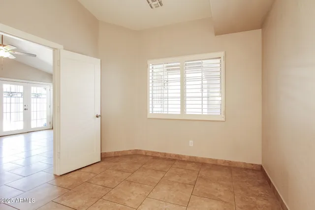 a view of an empty room with a window