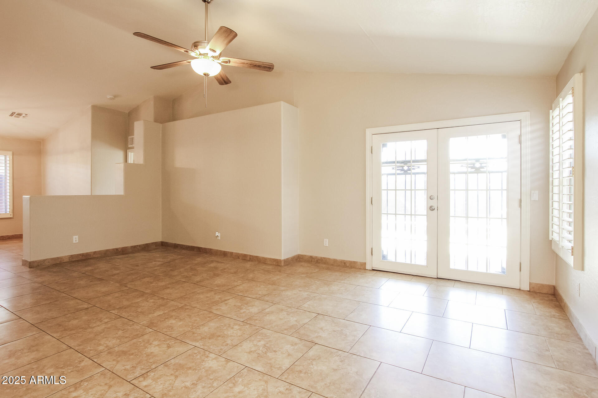 3750 South Conestoga Road Apache Junction, AZ 85119 - Photo 3 of 21 a view of an empty room with a window