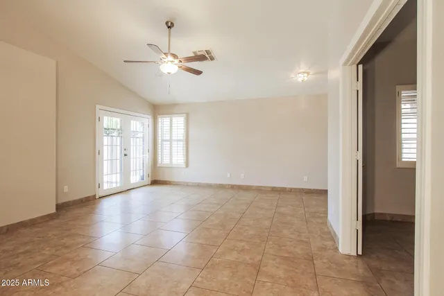 a view of an empty room with a window