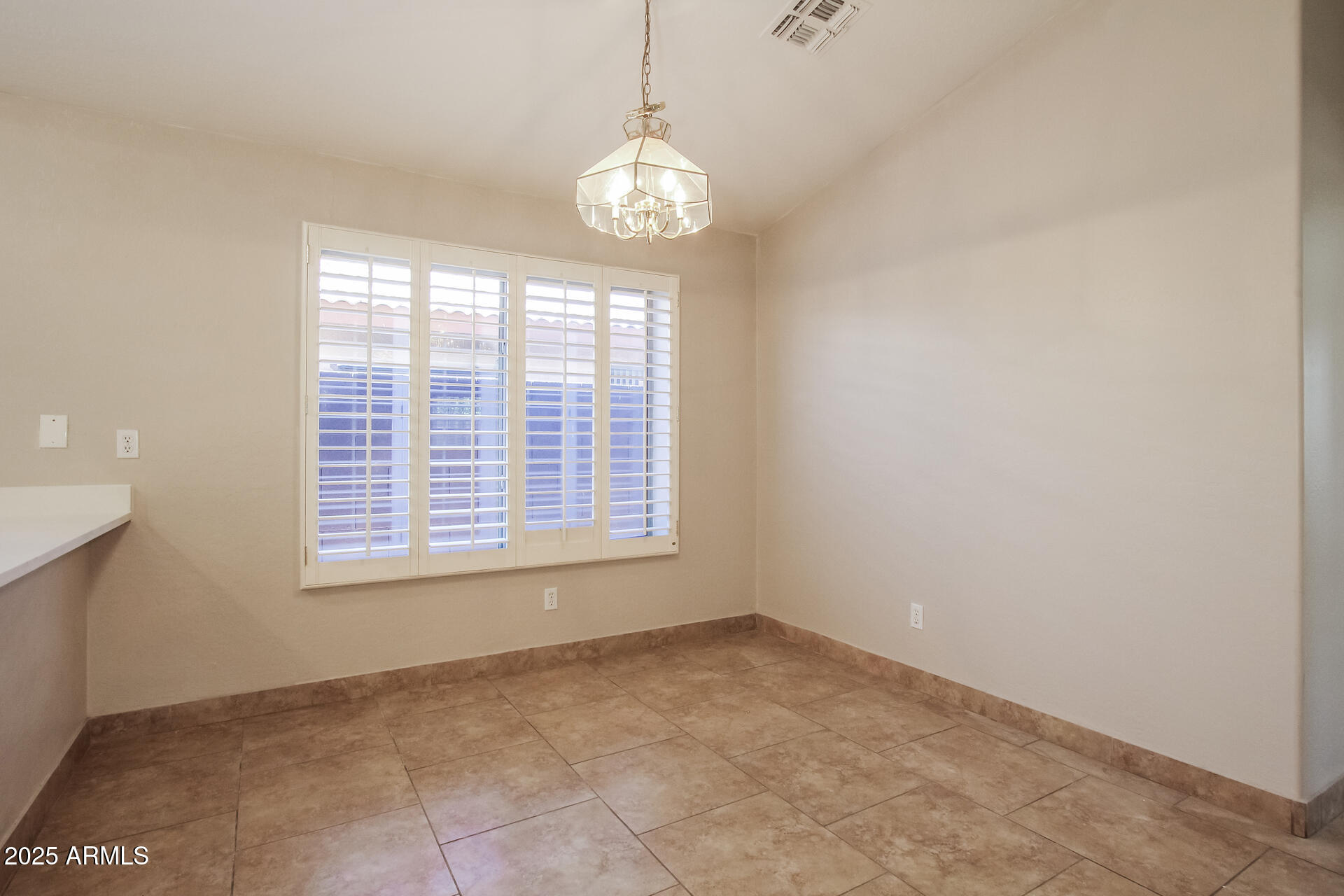3750 South Conestoga Road Apache Junction, AZ 85119 - Photo 6 of 21 a view of an empty room with a window