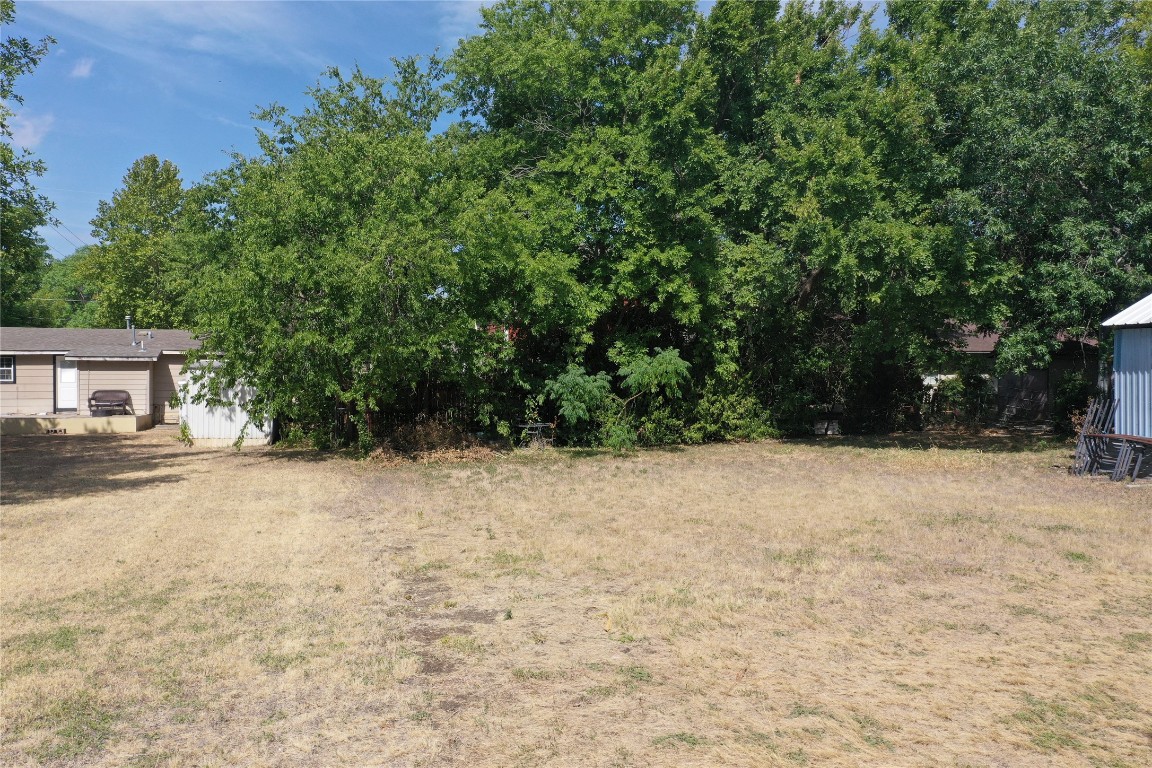 910 East 20th Street Georgetown, TX 78626 - Photo 12 of 19 a view of a house with a yard and garage